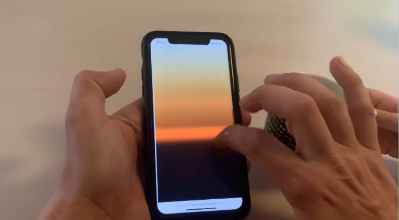 Hands holding a iPhone